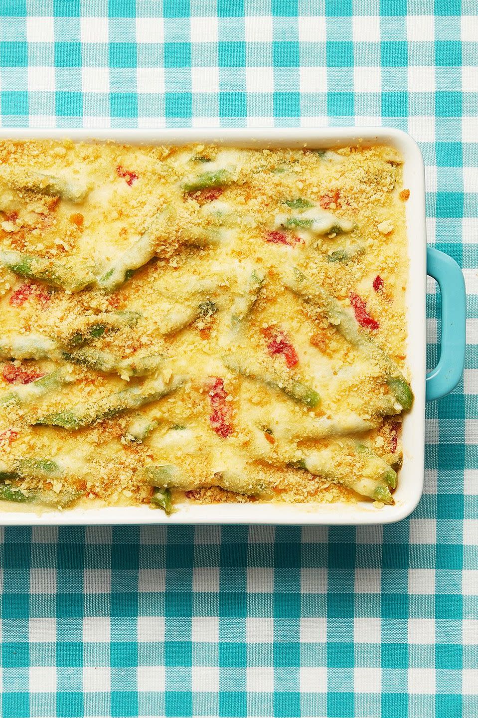 green bean casserole with pimentos on blue checkered linen