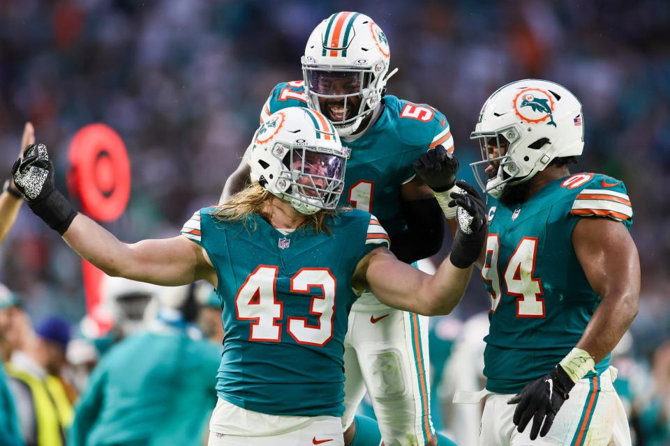 Dec 24, 2023; Miami Gardens, Florida, USA; Miami Dolphins linebacker Andrew Van Ginkel (43) celebrates with defensive tackle Christian Wilkins (94) and linebacker David Long Jr. (51) after a play against the Dallas Cowboys during the second quarter at Hard Rock Stadium. Mandatory Credit: Sam Navarro-USA TODAY Sports