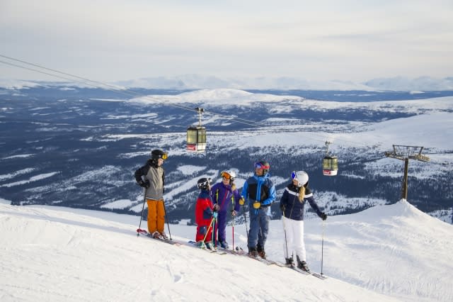 family skiing in are, sweden, scandinavia