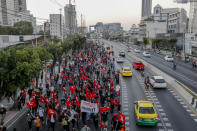 Anti-government protesters march to the criminal court during a protest in Bangkok, Thailand, Saturday, March 6, 2021. A new faction of Thailand's student-led anti-government movement calling itself REDEM, short for Restart Democracy, planned to march to Bangkok's Criminal Court Saturday to highlight the plight of several detained leaders of the protest movement. (AP Photo/Sakchai Lalit)