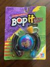 <p>You didn't know stress until you were at the highest speed of Bop It on the playground, and everyone was watching. The <a href="https://www.ebay.com/itm/BRAND-NEW-SEALED-Bop-It-Extreme-Mini-Keychain-2000-Pocket-Hand-held-Vintage/174485116904?hash=item28a01f97e8:g:pNMAAOSwLA9fjJu3" rel="nofollow noopener" target="_blank" data-ylk="slk:mini version of the game;elm:context_link;itc:0;sec:content-canvas" class="link ">mini version of the game</a>, seen here, goes for as high as $200 today. </p>