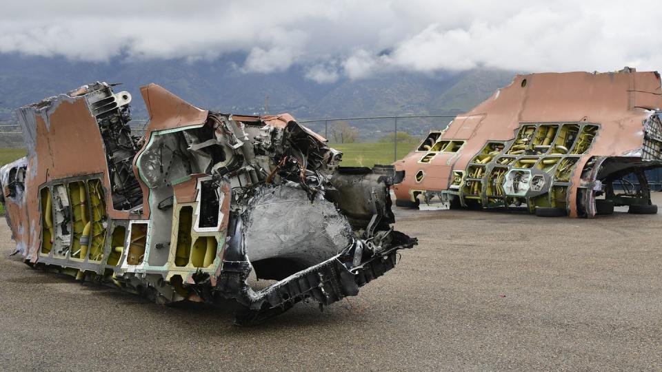 A salvaged F-35A fuselage sits in two sections after being cut in half with the volunteer help of a civilian saw manufacturing company, May 4, 2022, at Hill Air Force Base, Utah. The aircraft was condemned after an accident and is currently being transformed into sectional training aids by the 372nd Training Squadron, Detachment 3, for use during instruction of F-35 maintainers. (Todd Cromar/Air Force)