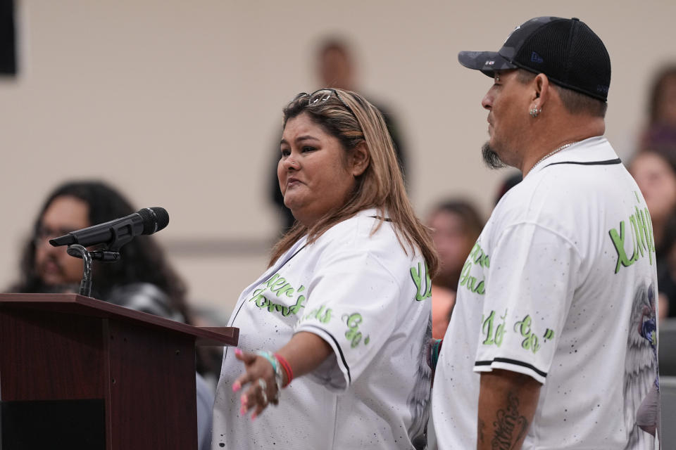 Felicia Martinez, left, and husband Abel Lopez, right, whose son Xavier was among 19 children killed in the massacre at Robb Elementary, speak at a special city council meeting in Uvalde, Texas, Thursday, March 7, 2024. (AP Photo/Eric Gay)