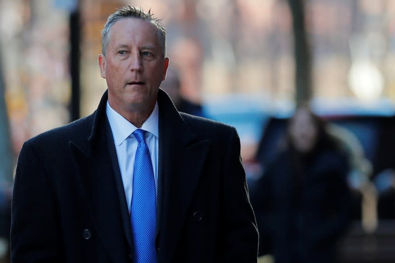 Martin Fox arrives at the federal courthouse before entering a plea in Boston