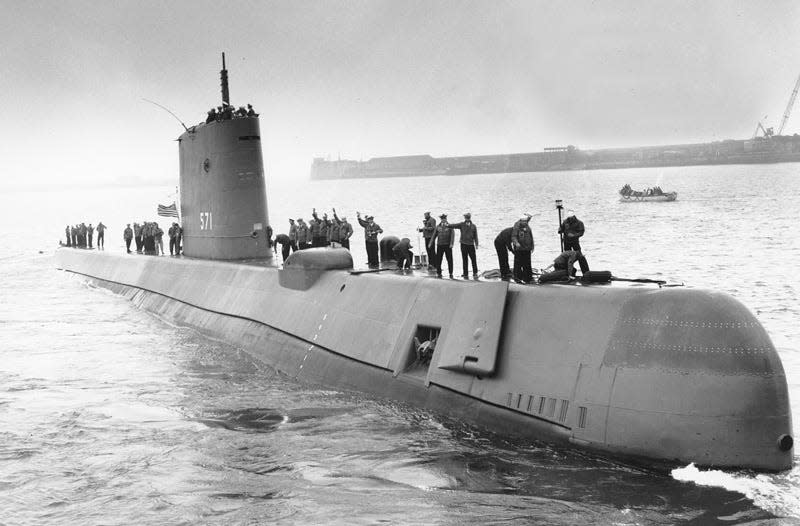 The U.S. Navy's nuclear-powered submarine USS Nautilus leaves for home at Portland, Dorset on Aug. 18, 1958. (AP Photo)