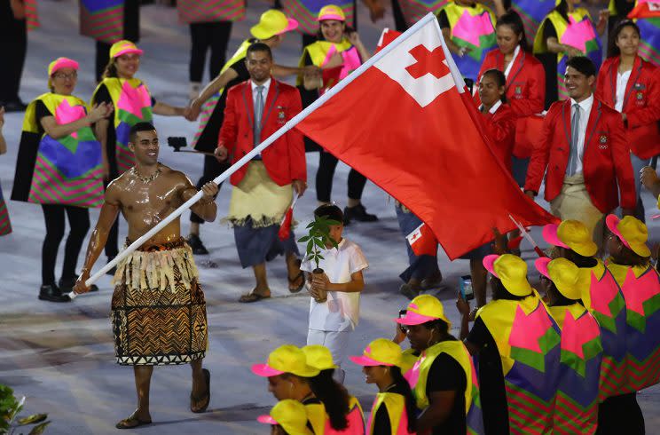 RIO DE JANEIRO, BRAZIL - AUGUST 05: Pita Nikolas Aufatofua of Tonga carries the flag during the Opening Ceremony of the Rio 2016 Olympic Games at Maracana Stadium on August 5, 2016 in Rio de Janeiro, Brazil. (Photo by Clive Brunskill/Getty Images)