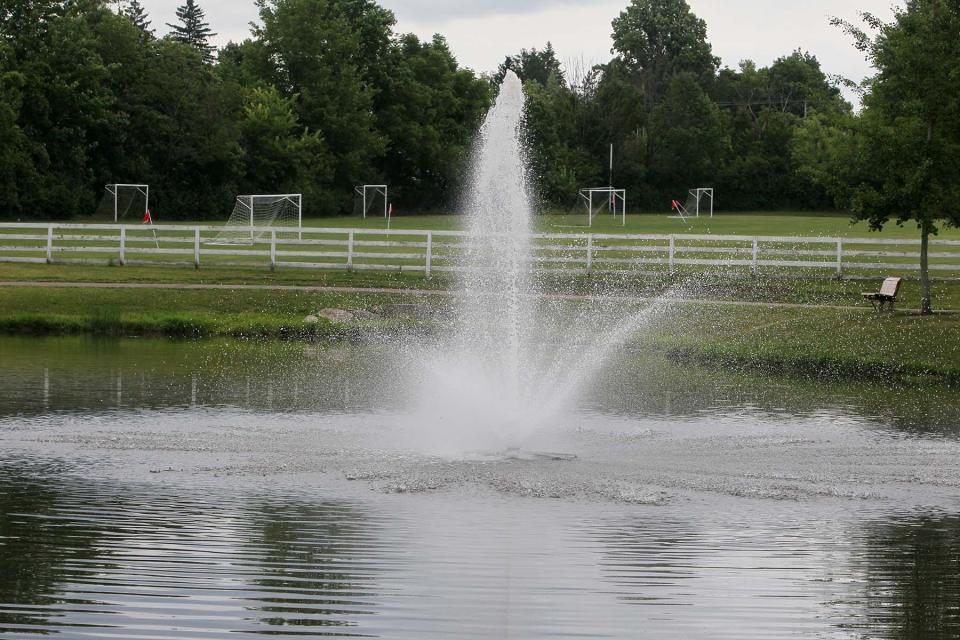 A water fountain in a pond along a short path at Richfield Woods Park located at 4100 Broadview Road in Richfield. It also has soccer and baseball fields.