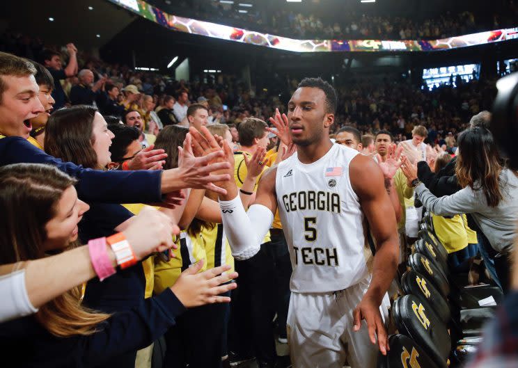 Josh Okogie high-fives fans after Georgia Tech’s win over Notre Dame. (AP)