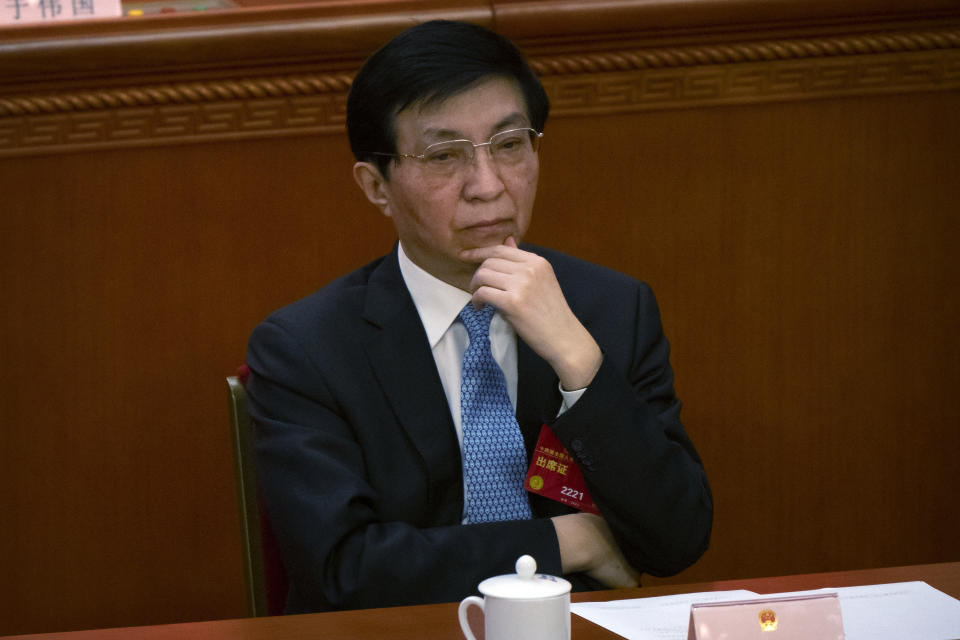 Wang Huning attends a session of China's National People's Congress (NPC) at the Great Hall of the People in Beijing, Friday, March 10, 2023. Six men sit alongside Chinese leader Xi Jinping on the ruling Communist Party's all-powerful Politburo Standing Committee, handling major portfolios from propaganda to corruption fighting. (AP Photo/Mark Schiefelbein)