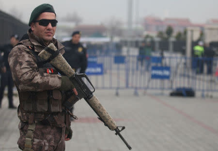 A member of police special forces stands guard during the first hearing of the trial for Turkish soldiers accused of attempting to assassinate Turkish President Tayyip Erdogan on the night of the failed last year's July 15 coup, in Mugla, Turkey, February 20, 2017. REUTERS/Kenan Gurbuz