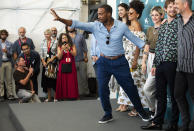 File - Actor Anthony Mackie gestures to photographers at the photo call for the film 'Seberg' at the Venice Film Festival. The 77th Venice Film Festival will kick off on Wednesday, Sept. 2, 2020, but this year's edition will be unlike any others. Coronavirus restrictions will mean fewer Hollywood stars, no crowds interacting with actors and other virus safeguards will be deployed. (Photo by Arthur Mola/Invision/AP, File)