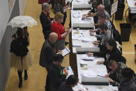 Ballot papers cast in the 2019 general election are counted in Islington in London, Thursday, Dec. 12, 2019. An exit poll in Britain's election projects that Prime Minister Boris Johnson's Conservative Party likely will win a majority of seats in Parliament. That outcome would allow Johnson to fulfil his plan to take the U.K. out of the European Union next month. (AP Photo/Alberto Pezzali)