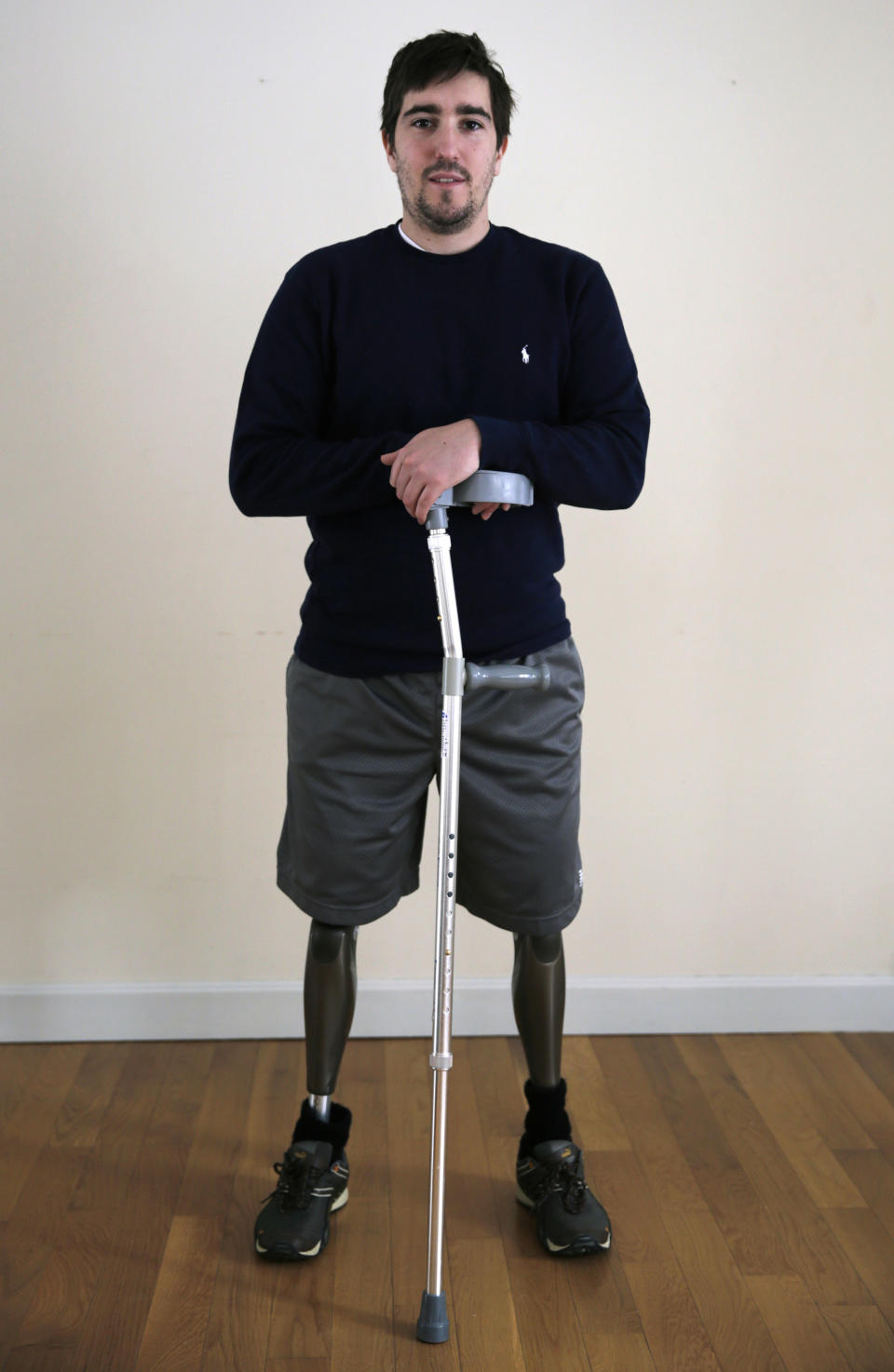 In this Friday, March 14, 2014 photo, Jeff Bauman stands in his home in Carlisle, Mass. Bauman, who lost both of his legs in the Boston Marathon bombings, helped identify one of the two brothers accused of setting off the explosions, which killed three and injured more that 260 others. (AP Photo/Charles Krupa)