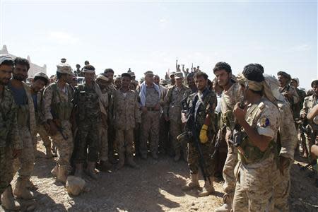 Yemen's Defence Minister Major General Muhammad Nasir Ahmad (C, white scarf) visits Mayfaa, in the southeastern province of Shabwa May 1, 2014 in this handout photo provided by Yemen's defence ministry. REUTERS/Yemen's Defence Ministry/Handout via Reuters