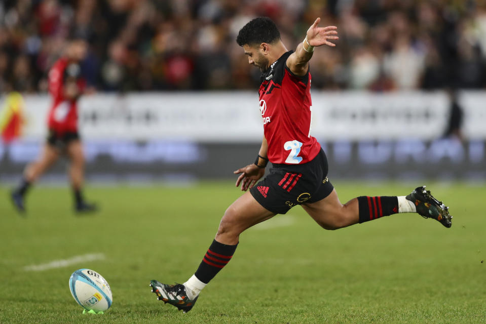 Richie Mo'unga of the Crusaders takes a kick at goal during the Super Rugby Pacific final between the Chiefs and the Crusaders in Hamilton, New Zealand, Saturday, June 24, 2023. (Aaron Gillions/Photosport via AP)