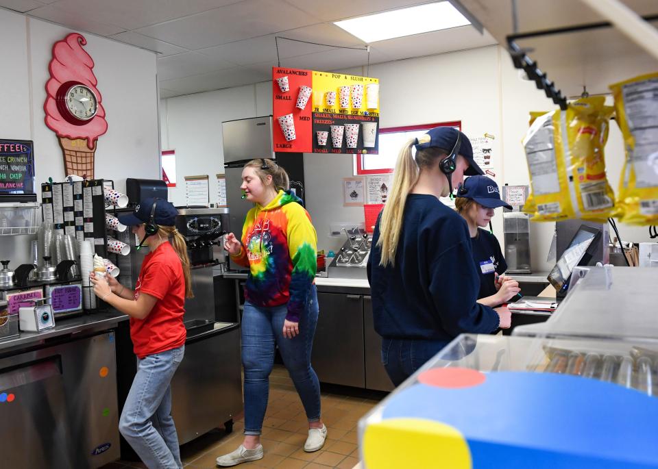 Mckenzie Vickery, 14, Kelsey Pickart, 18, Jamie Young, 18, and Hannah Price, 14, work at the B&G Milky Way on 69th Street on Thursday, April 7, 2022, in Sioux Falls.