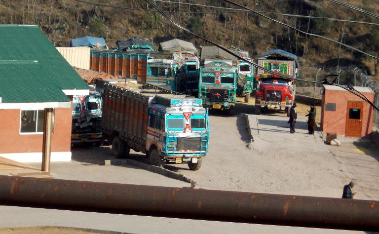 Indian goods trucks parked outside the office of Trade and Travel Authority in Pakistani Kashmir, in Chokothi sector along the Line of Control on January 18, 2014