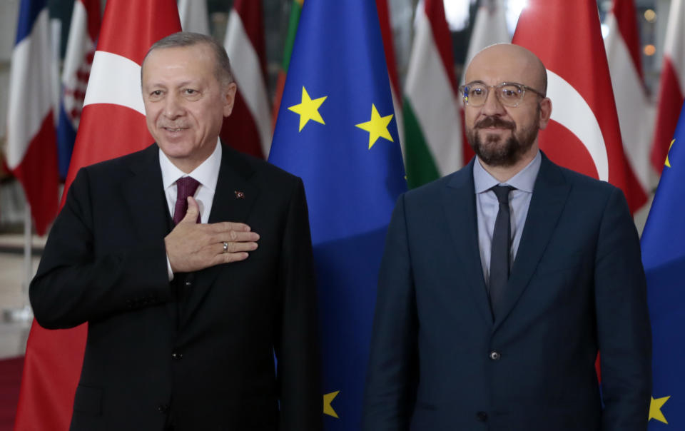 FILE - Turkish President Recep Tayyip Erdogan, left, is welcomed by European Council President Charles Michel prior to a meeting at the European Council building in Brussels, Monday, March 9, 2020. Leaders from more than 40 countries will gather Thursday, Oct. 6, 2022, in Prague, to launch a "European Political Community" aimed at boosting security and economic prosperity across the continent, but critics claim the new forum is an attempt to put the brakes on European Union enlargement. (AP Photo/Virginia Mayo, File)