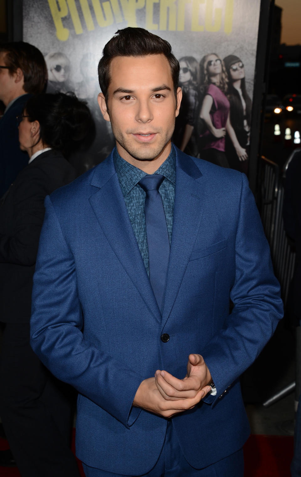 closeup of him with gelled hair wearing a suit