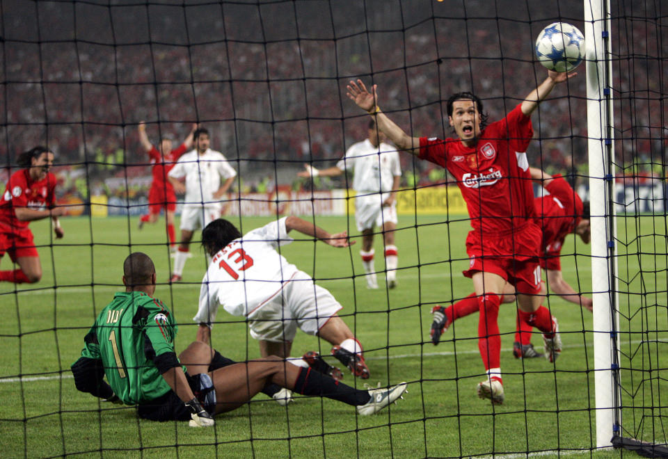 FILE - In this Wednesday, May 25, 2005 file photo, Liverpool's Luis Garcia, right, celebrates after his teammate Xabi Alonso, behind him at right, scored his team's 3rd goal, during the Champions League Final between AC Milan and Liverpool at the Ataturk Olympic Stadium in Istanbul, Turkey. M is for Miracle, as in the Miracle of Istanbul. 3-0 down at halftime, Liverpool looked finished. But in an incredible six-minute period early in the second half, Liverpool, inspired by captain Steven Gerrard, had erased the deficit. The match ended up going to a penalty shootout, which Liverpool won to claim its fifth European Cup in the "The Miracle of Istanbul." (AP Photo/Thomas Kienzle, File)