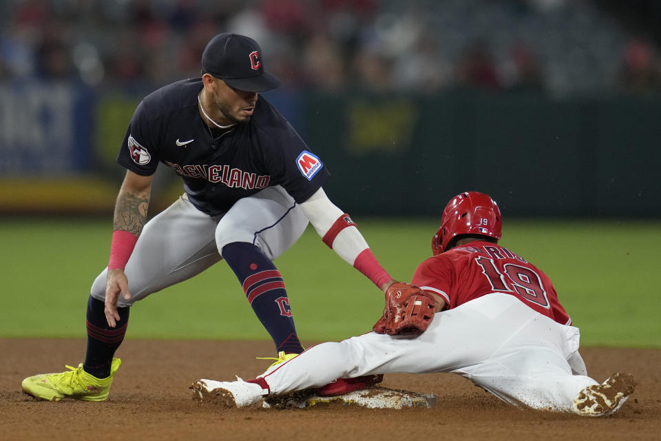 Los Angeles Angels' Kyren Paris (19) steals second base ahead of a tag by Cleveland Guardians shortstop Gabriel Arias, left, during the third inning of a baseball game in Anaheim, Calif., Thursday, Sept. 7, 2023. (AP Photo/Ashley Landis)