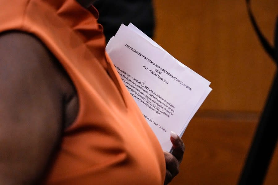 County Clerk Che Alexander departs the courtroom of Fulton County Superior Court Judge Robert McBurney, Monday, Aug. 14, 2023, in Atlanta. (AP Photo/Brynn Anderson)