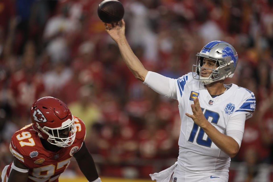 Detroit Lions quarterback Jared Goff (16) throws under pressure from Kansas City Chiefs defensive end Felix Anudike-Uzomah (97) during the first half of an NFL football game Thursday, Sept. 7, 2023, in Kansas City, Mo. (AP Photo/Charlie Riedel)