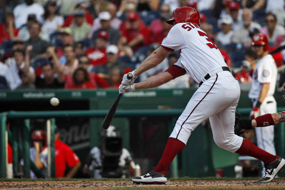 Washington Nationals' Stephen Strasburg hits an RBI single during the fifth inning of the team's baseball game against the Cincinnati Reds at Nationals Park, Wednesday, Aug. 14, 2019, in Washington. (AP Photo/Alex Brandon)