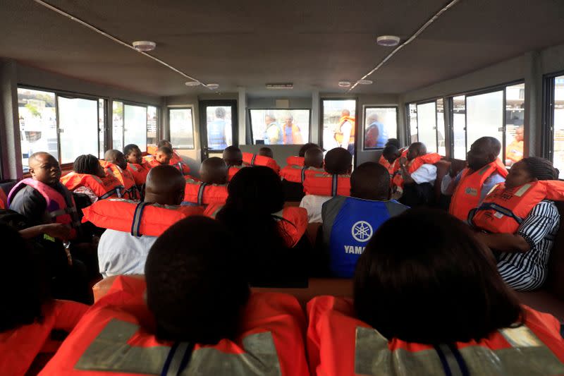 Passengers are seen inside a boat in Lagos