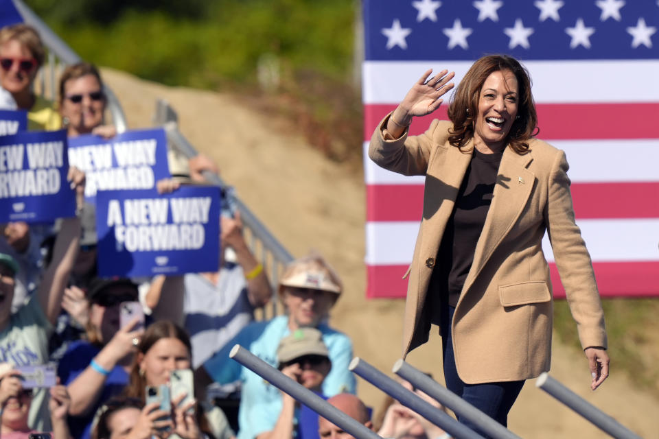 Democratic presidential nominee Vice President Kamala Harris waves as she steps on stage to address a crowd, Wednesday, Sept. 4, 2024, during a campaign stop, in North Hampton, N.H. (AP Photo/Steven Senne)