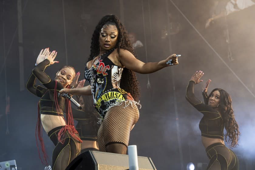 Three women dancing on a stage