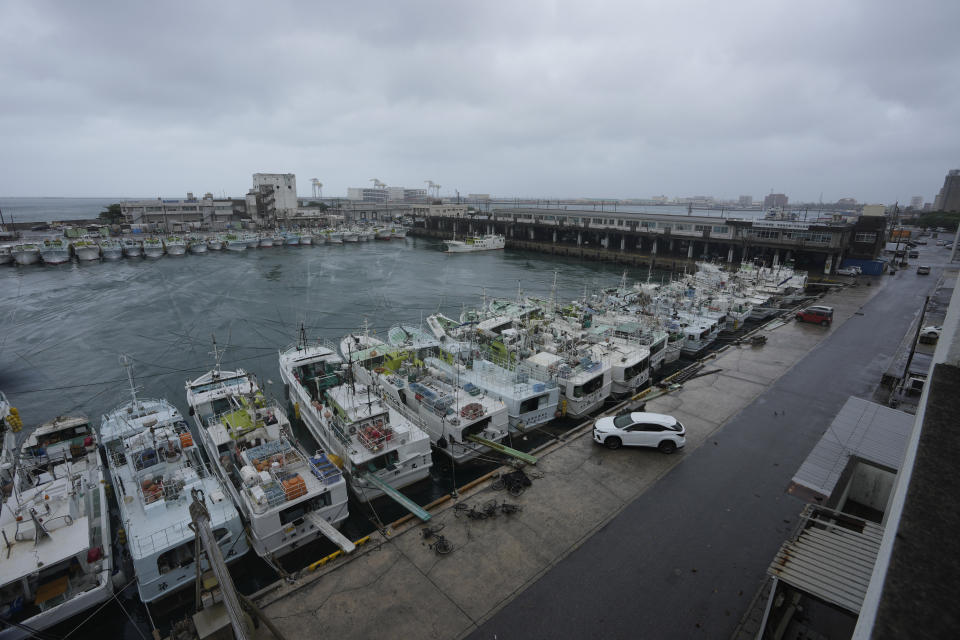 Fishing boats are secured by rope at the Tomari fishery port in Naha in the main Okinawa island, southern Japan, Thursday, June 1, 2023, as a tropical storm was approaching to the Okinawa islands. (AP Photo/Hiro Komae)