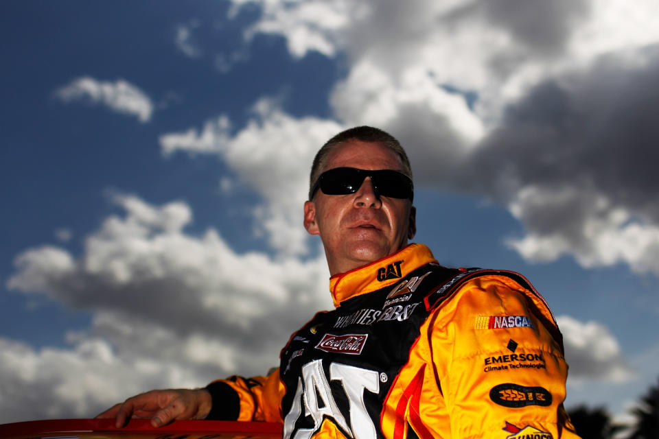 DAYTONA BEACH, FL - FEBRUARY 19: Jeff Burton, driver of the #31 Caterpillar Chevrolet, climbs from his car after qualifying for the NASCAR Sprint Cup Series Daytona 500 at Daytona International Speedway on February 19, 2012 in Daytona Beach, Florida. (Photo by Tom Pennington/Getty Images for NASCAR)