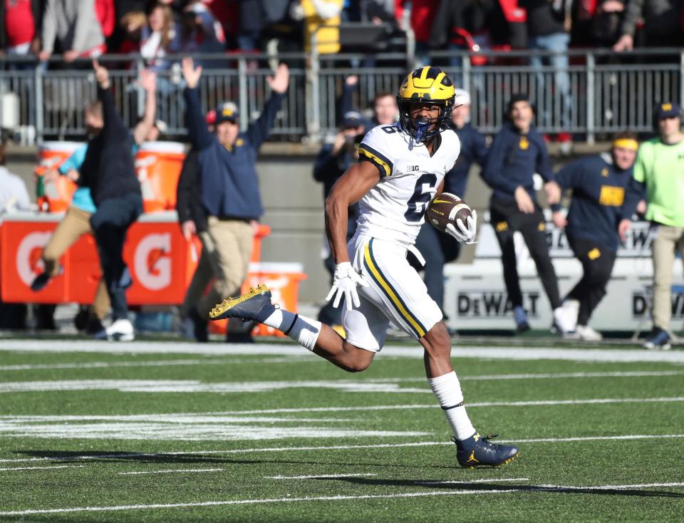 Michigan Wolverines wide receiver Cornelius Johnson (6) catches his second touchdown pass against the Ohio State Buckeyes during the first half at Ohio Stadium in Columbus on Nov. 26, 2022.