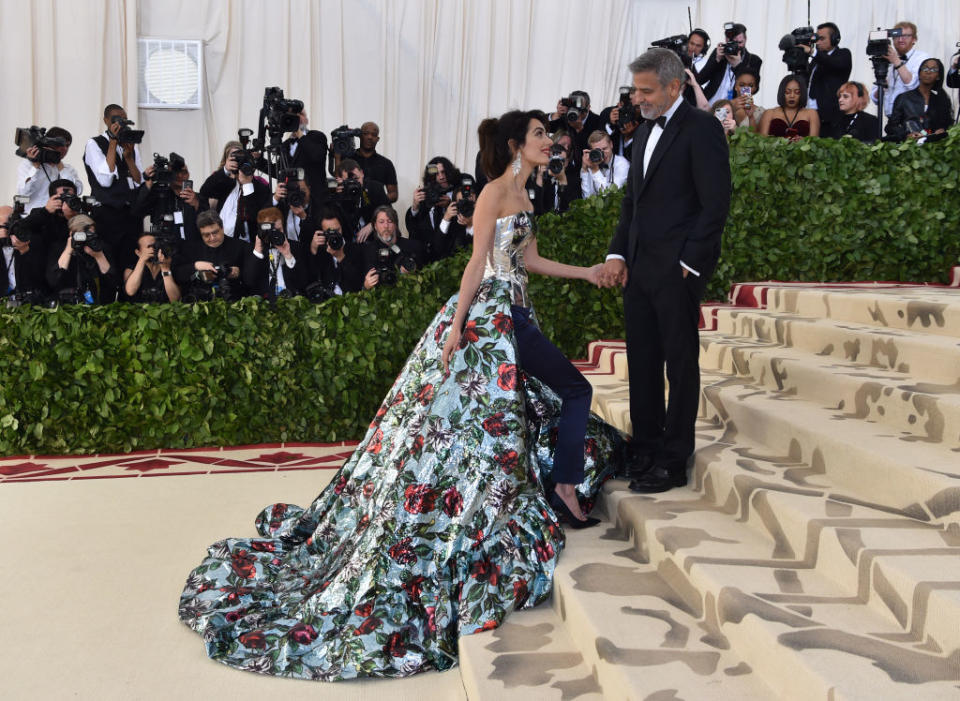 Amal Clooney and George Clooney arrive at the 2018 Met Gala on May 7, 2018 in New York. (Photo: HECTOR RETAMAL/AFP/Getty Images)