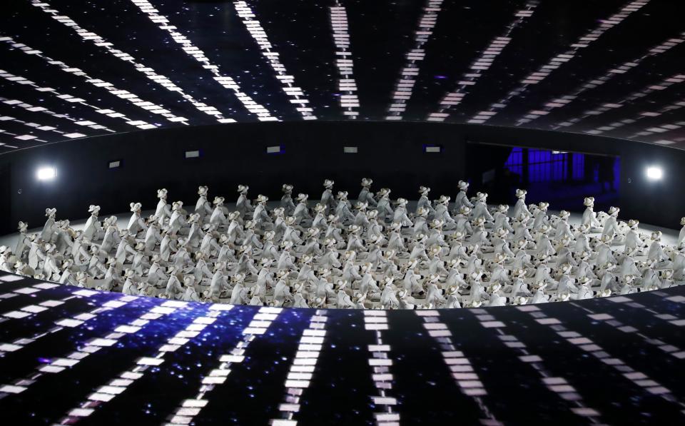 <p>Performers take part in the opening ceremony. REUTERS/Stefano Rellandini </p>