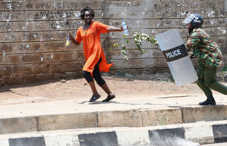 A supporter of the opposition National Super Alliance (NASA) coalition runs after riot policemen dispersed protesters during a demonstration calling for the removal of Independent Electoral and Boundaries Commission (IEBC) officials in Nairobi, Kenya September 26, 2017. REUTERS/Thomas Mukoya