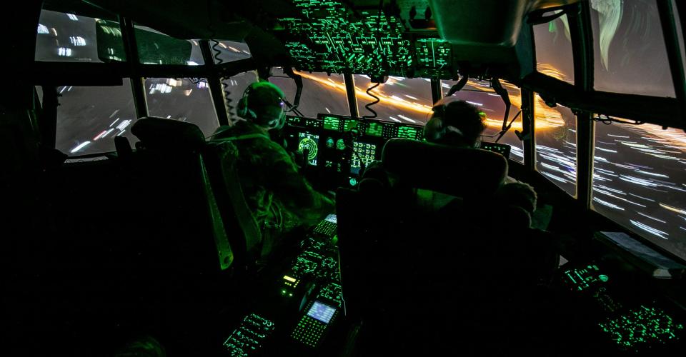 The flight deck of a Royal Air Force C-130J conducting a supply run across the Middle East. <em>Crown Copyright</em>