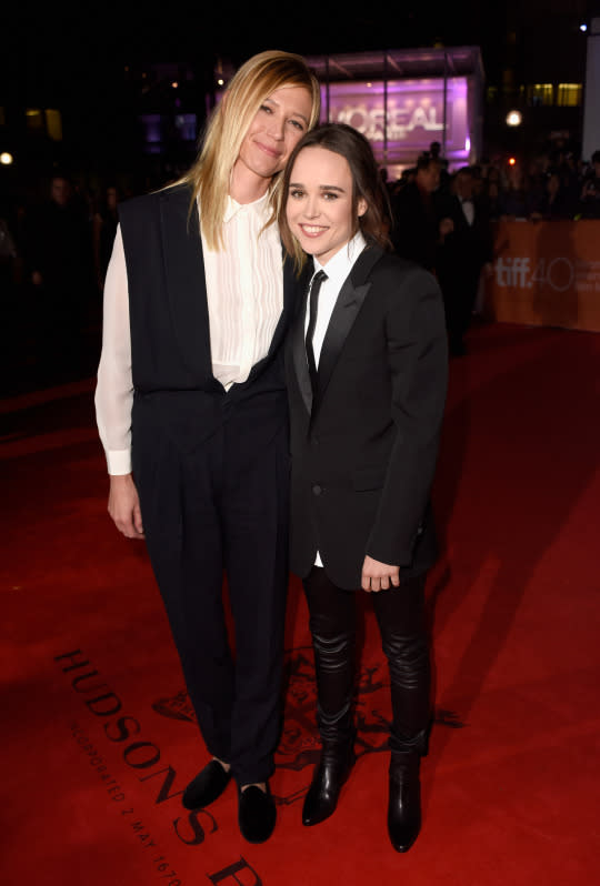 Ellen Page in leather pants with girlfriend Samantha Thomas in a jumpsuit.