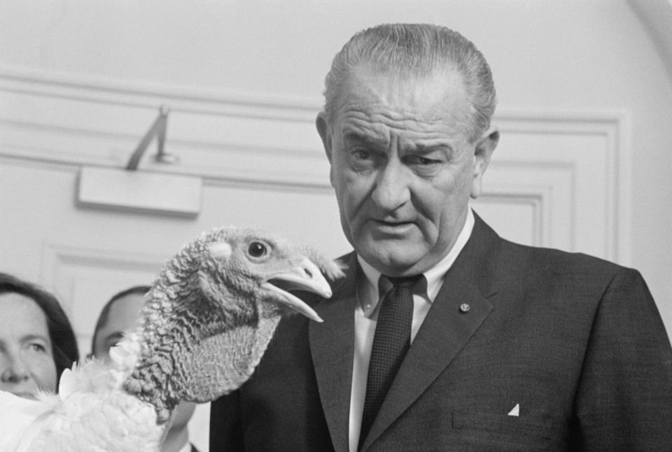 President Lyndon B. Johnson eyes a 40-pound Tom turkey