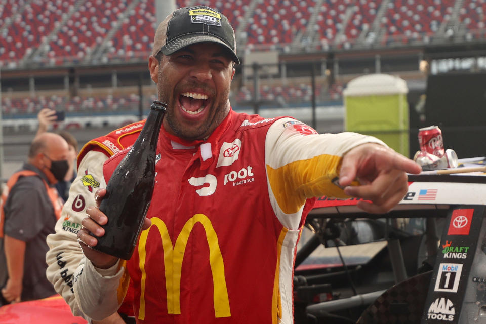 TALLADEGA, ALABAMA - OCTOBER 04: Bubba Wallace, driver of the #23 McDonald's Toyota, celebrates in the Ruoff Mortgage victory lane after winning the rain-shortened NASCAR Cup Series YellaWood 500 at Talladega Superspeedway on October 04, 2021 in Talladega, Alabama. (Photo by Chris Graythen/Getty Images)