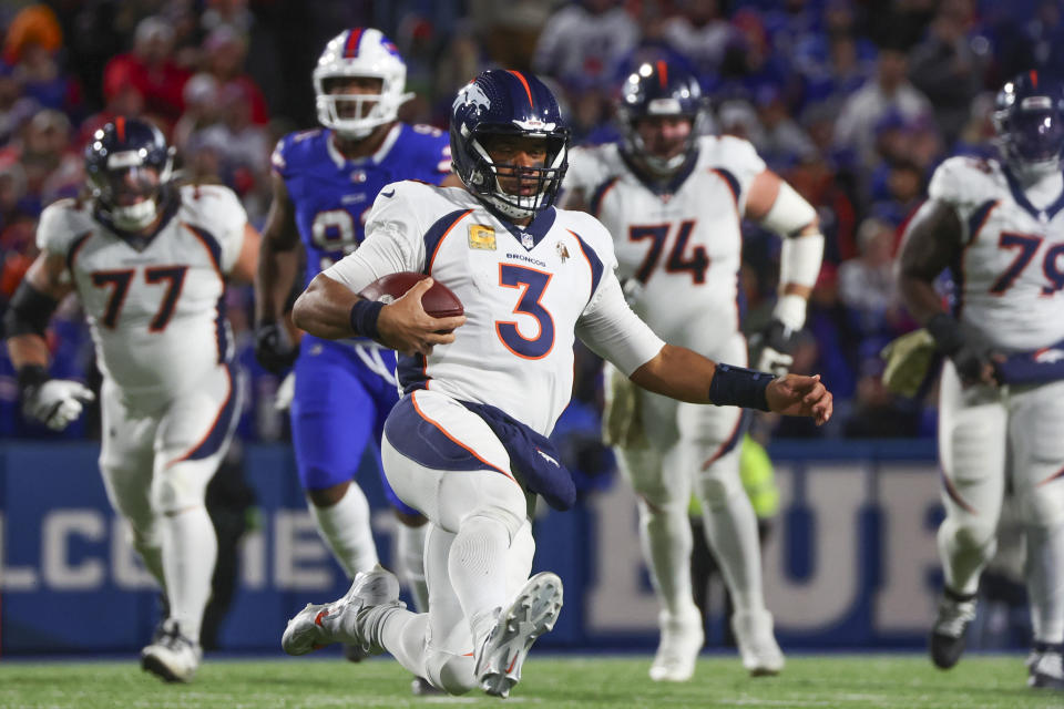 Denver Broncos quarterback Russell Wilson (3) slides for a first down during the first half of an NFL football game against the Buffalo Bills, Monday, Nov. 13, 2023, in Orchard Park, N.Y. (AP Photo/Jeffrey T. Barnes)