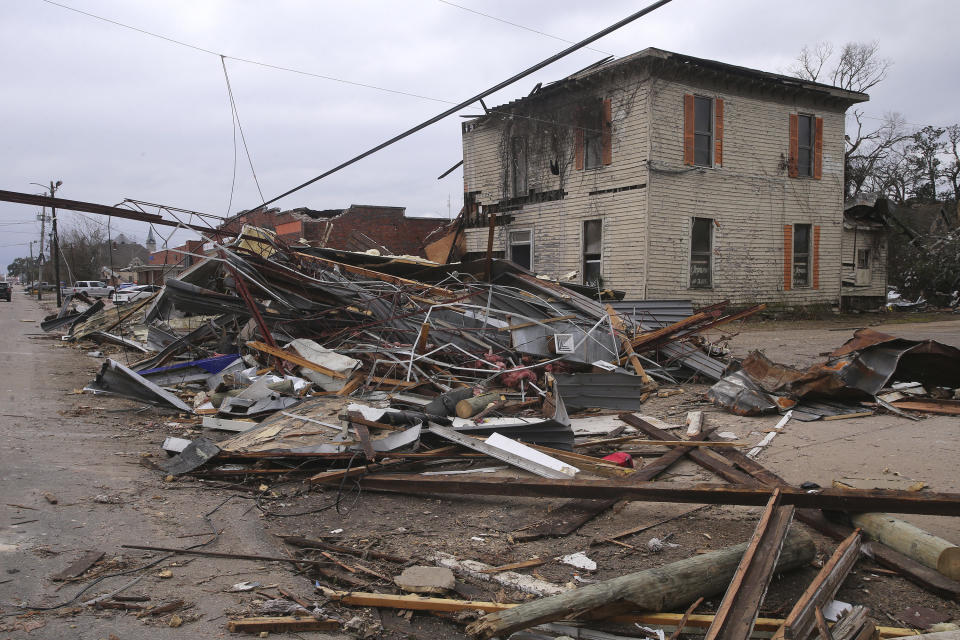 FILE - Debris from local businesses covers the street in Selma, Ala., Friday, Jan. 13, 2023, after a tornado passed through the area. After three nasty years, the La Nina weather phenomenon is gone, the National Oceanic and Atmospheric Administration said Thursday, March 9. (AP Photo/Stew Milne, File)