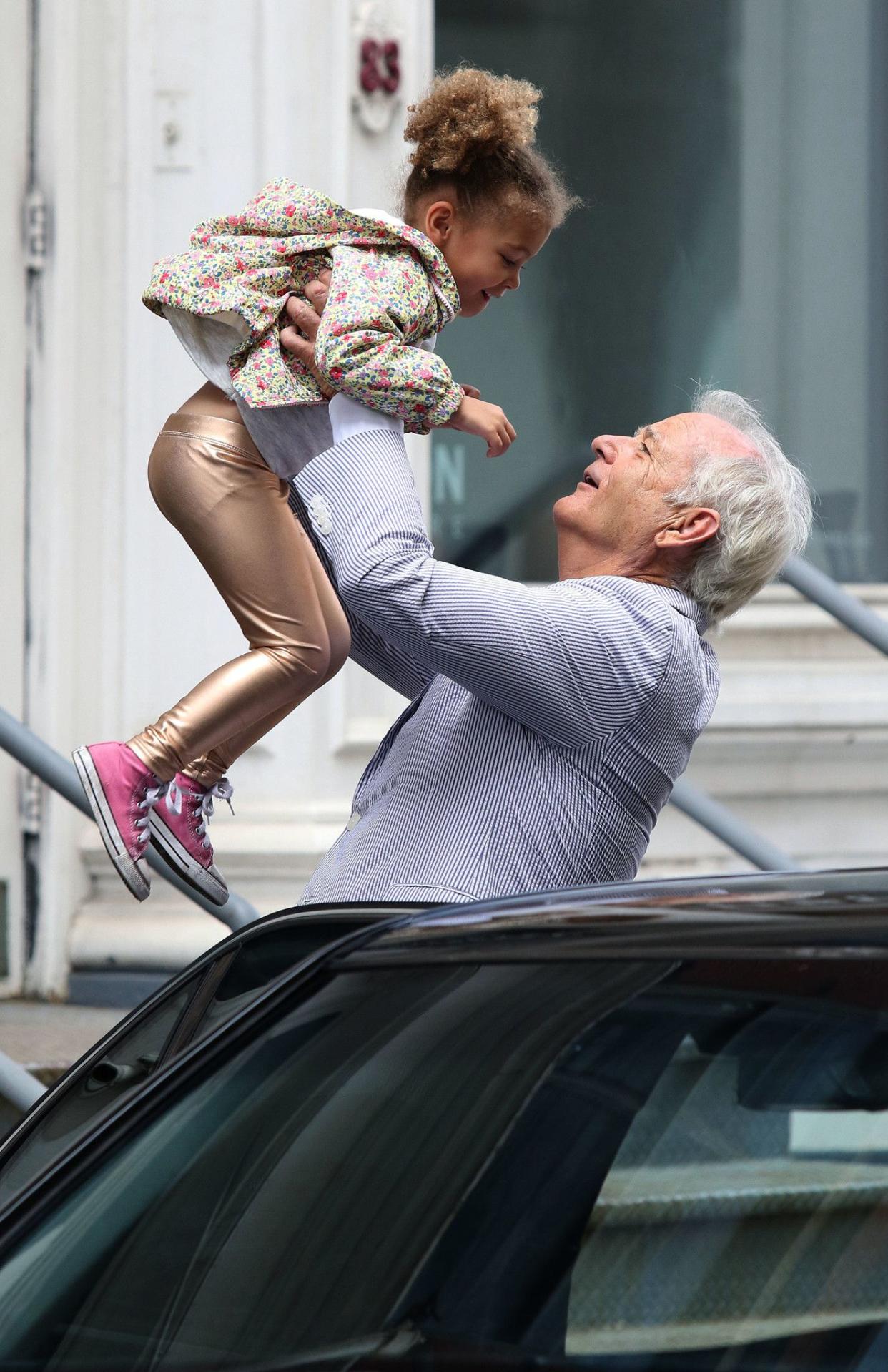 Bill Murray then greeted a smaller co-star, presumably his character's granddaughter, with a playful lift in the air.