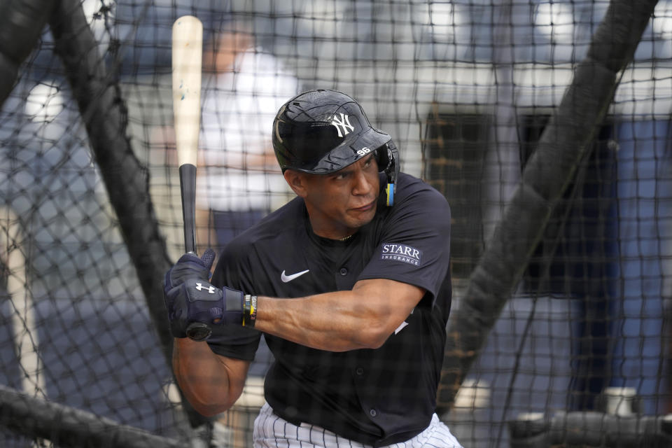 New York Yankees catcher Agustin Ramirez hits in the batting cage during a baseball spring training workout Thursday, Feb. 15, 2024, in Tampa, Fla. (AP Photo/Charlie Neibergall)