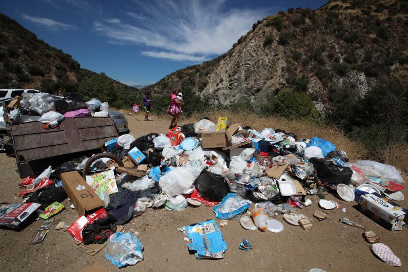 San Gabriel Mountains National Monument, CA - July 26: Trash piles up along the East Fork of the San Gabriel River in the San Gabriel Mountains National Monument in the Angeles National Forest Wednesday, July 26, 2023. Volunteers who attempt to clean it up refer to it as "the east fork toilet." Nine years after then President Obama upgraded Southern California's mountainous backyard to national monument status, with a promise of a cleaner and safer wilderness within an hour's drive of 18 million people, it is anything but. (Allen J. Schaben / Los Angeles Times)