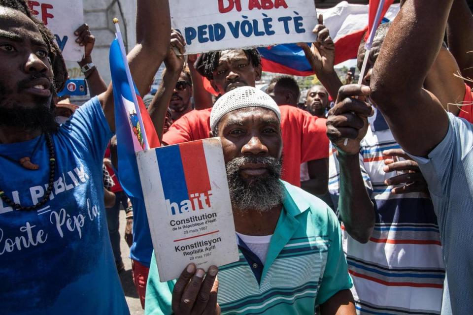 Haitians demonstrate during a protest to denounce the draft constitutional referendum carried by the President Jovenel Moise on March 28, 2021 in Port-au-Prince.