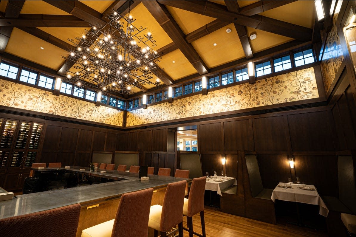 The bar at Oak Park sits in the center of the restaurant with the three dining rooms accessible from it.