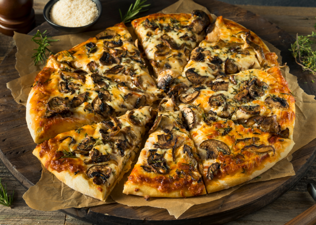 Mushroom pizza on tray.