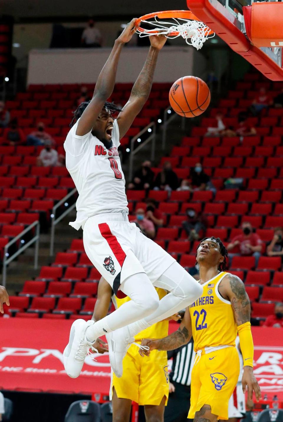 N.C. State’s D.J. Funderburk (0) slams in two during the second half of N.C. State’s 65-62 victory over Pittsburgh at PNC Arena in Raleigh, N.C., Sunday, February 28, 2021.